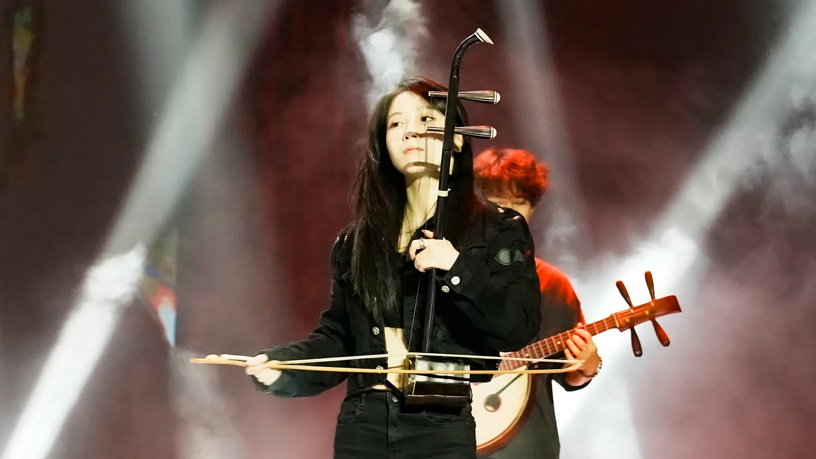A musician playing an erhu, a two-stringed Chinese bowed fiddle